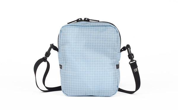 A back view of the Everyday Cubelet in Acuity Halcyon (light blue with a white grid) showing a completely fabric back.
